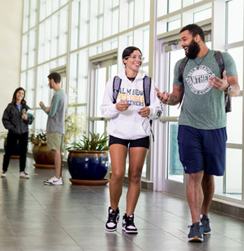 Two PBSC students walking on the Boca Raton Campus